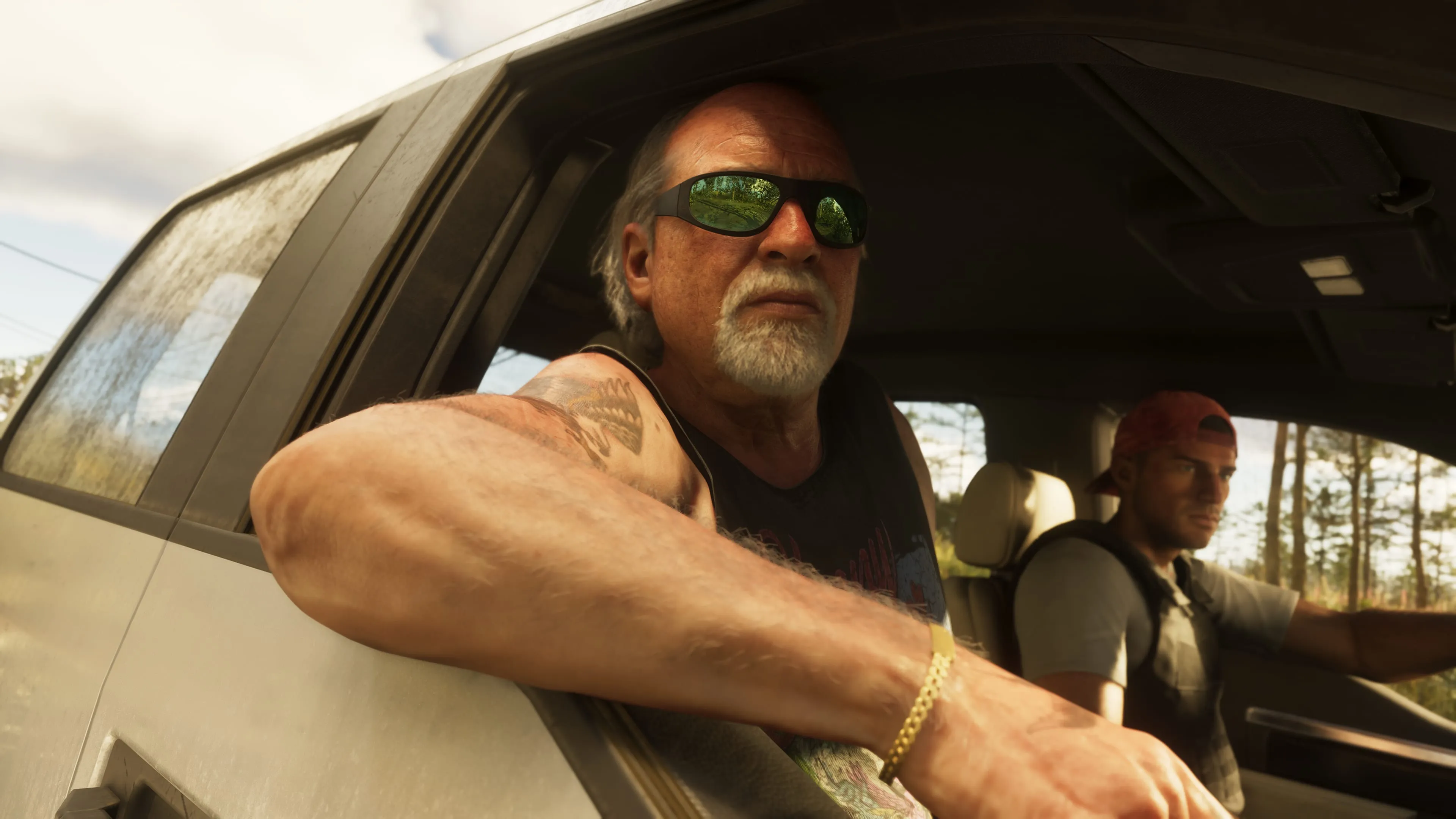 GTA 6 Brian Heder riding shotgun in a truck on a rural road